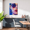wall art painting in the office depicts woman wearing round sunglasses and large hoop earrings