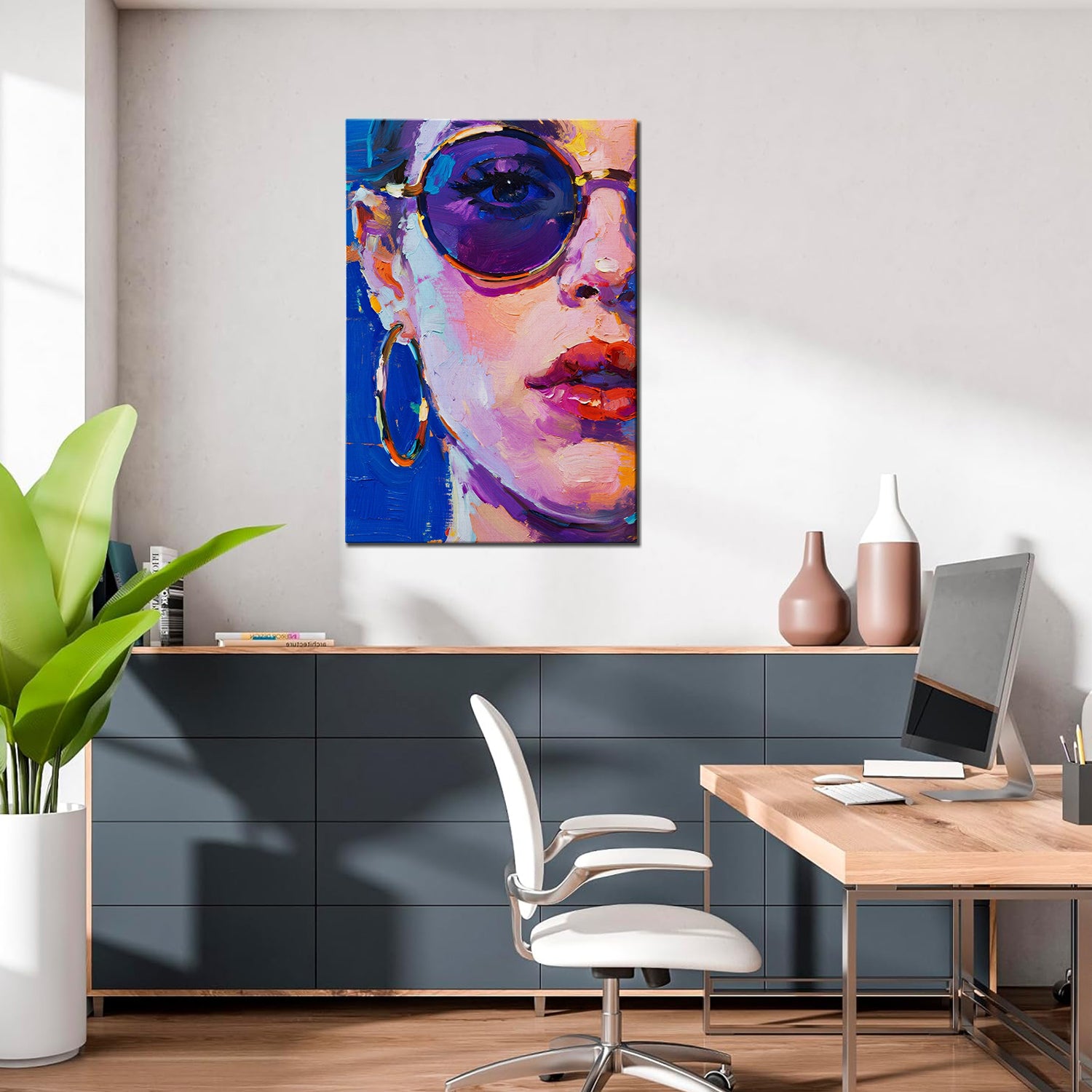 wall art painting in the office depicts woman wearing round sunglasses and large hoop earrings