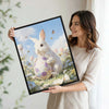 White Bunny Holding Purple Floral Easter Egg Wildflower Meadow Canvas Wall Art
