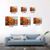 different size wall art painting of an autumn lakeside hangs on a simple and bright interior wall