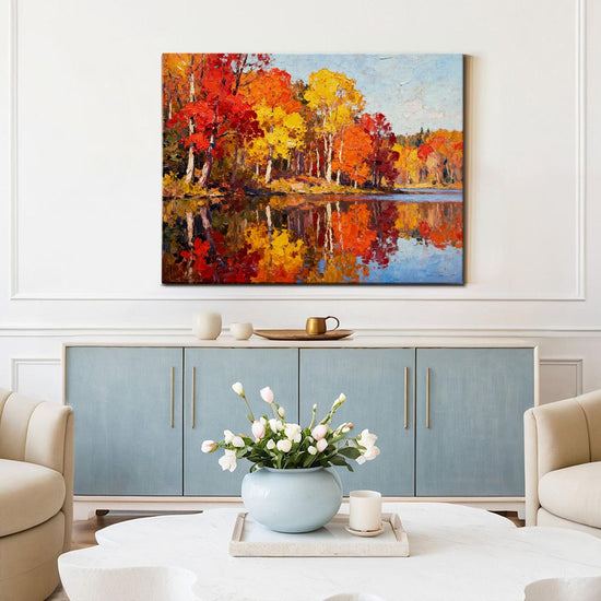 wall art painting of an autumn lakeside hangs on a simple and bright interior wall