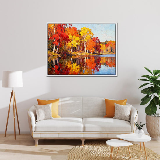 white frame wall art painting of an autumn lakeside hangs on a simple and bright interior wall