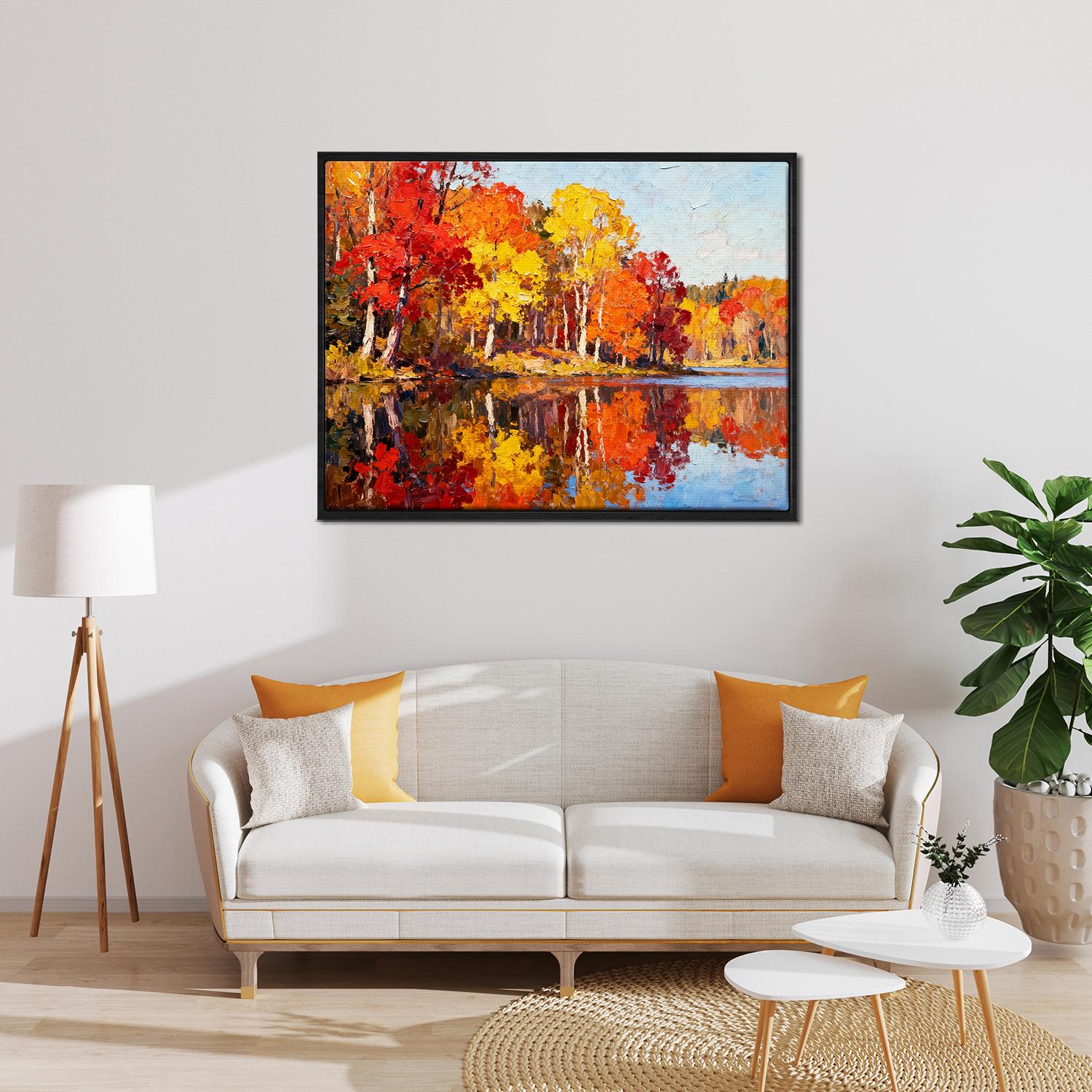 black frame wall art painting of an autumn lakeside hangs on a simple and bright interior wall