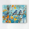 wall art canvas showing two bluebirds perched on a branch.