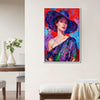 white frame wall art painting of a lady's portrait hanging on a white wall in a room