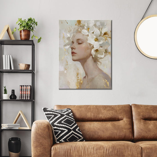 wall art canvas painting above the sofa depicts a woman wearing white flowers