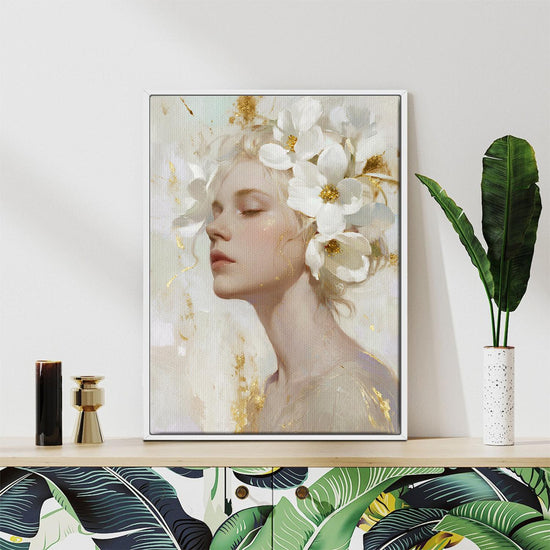 white frame wall art canvas painting depicts a woman wearing white flowers