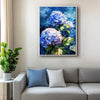 a white frame hydrangea wall art painting above the sofa