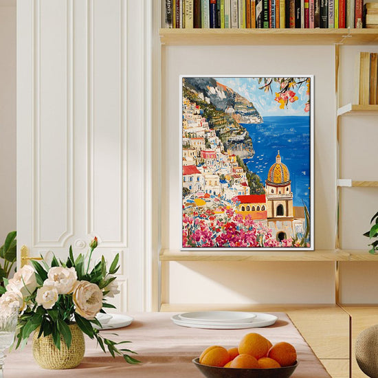 white frame seaside town scenery wall art painting canvas on the bookshelf