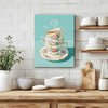 wall art canvas painting in the kitchen depicts stacked floral teacups