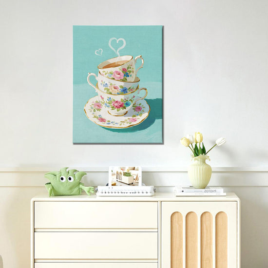 wall art canvas painting in the living room depicts stacked floral teacups