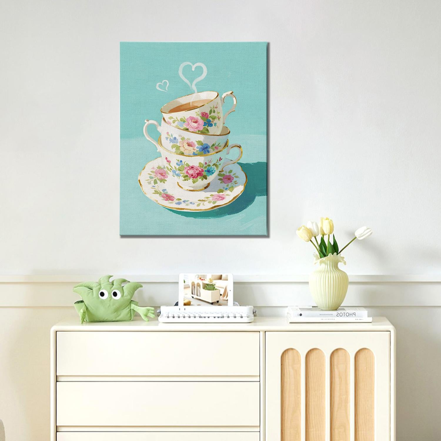 wall art canvas painting in the living room depicts stacked floral teacups