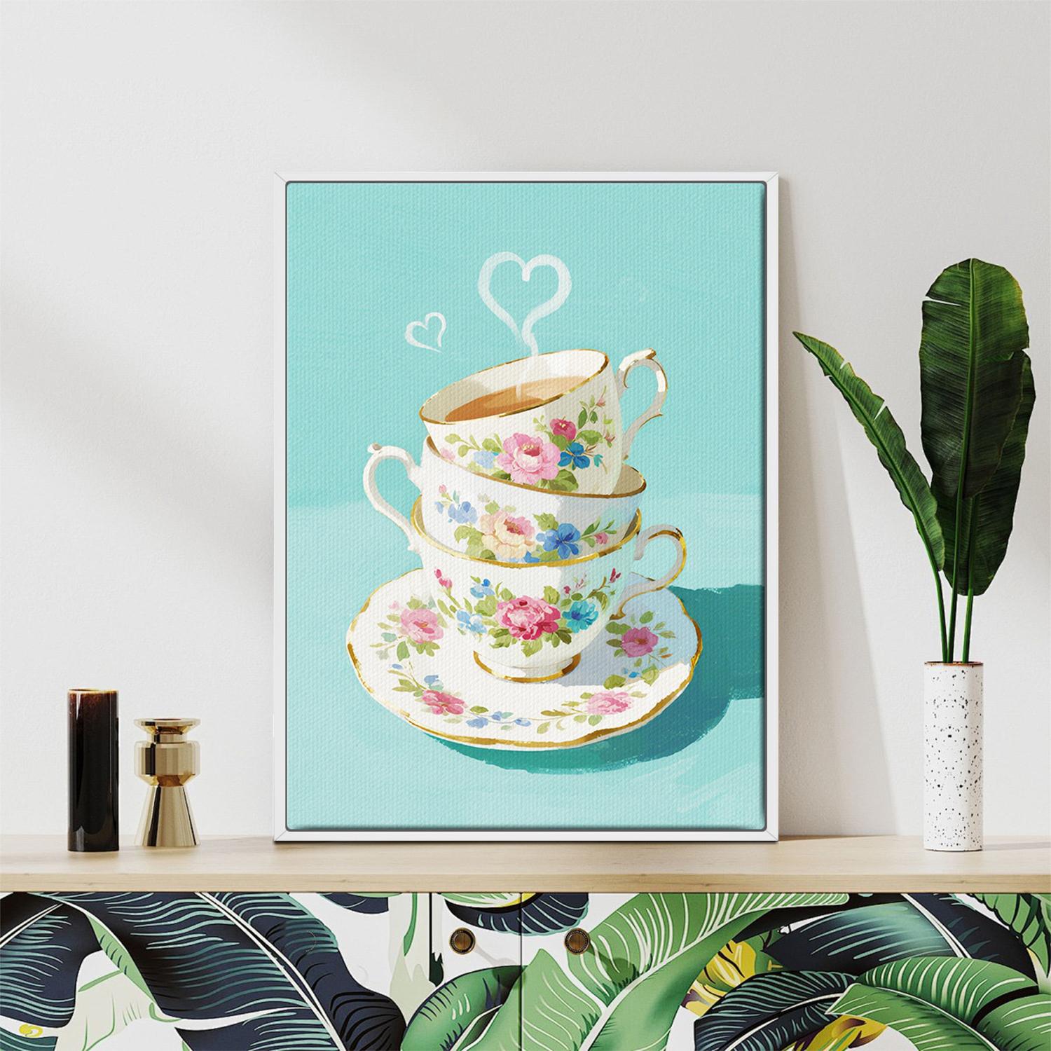 white frame wall art canvas painting depicts stacked floral teacups