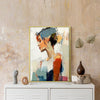 gold frame wall art women painting on the table