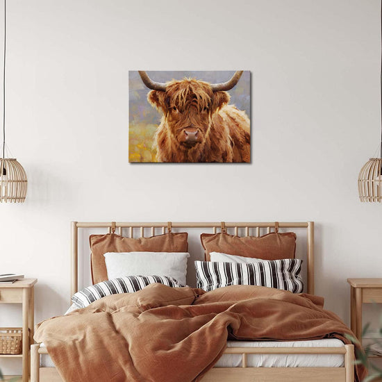 wall art canvas in the bedroom depicts highland cattle