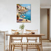 wall art canvas painting in the dining room showing a sunny seaside town with a table of red wine and flowers on the pier and a cat.