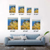 different size wall art painting depicting a cliffside cottage by the sea