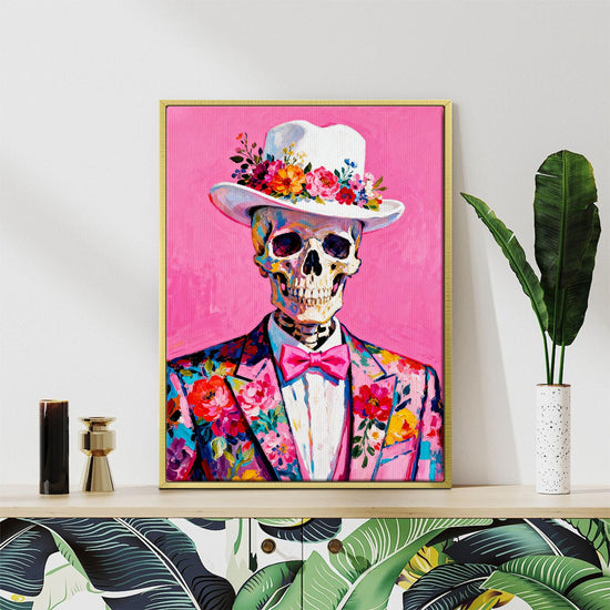 gold frame wall art canvas depicts skeleton in a suit