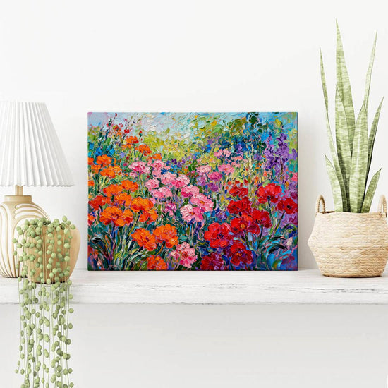 wall art canvas painting on the table depicts a colorful sea of ​​flowers